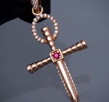 Dije cruz con swarovski blanco y fucsia 3.45gr / Largo 4.3cm / Oro Rosado Nac B