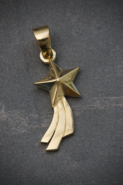 Dije estrella fugaz 2.15gr / largo 2.6cm / Oro Amarillo Nac M