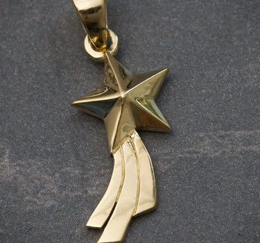 Dije estrella fugaz 2.15gr / largo 2.6cm / Oro Amarillo Nac M