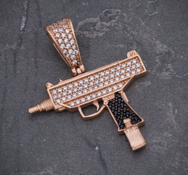 Dije mini uzi swarovski negro y blanco 3.85gr / Largo 3.4cm / Oro Rosado Nac M