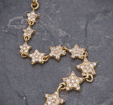 Dije estrellas con swarovski blanco 2.85gr / Largo 7.7cm / Oro Amarillo Nac M