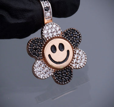 Dije flor giratorio swarovski negro y blanco 4.35gr / Largo 2.5cm / Oro Rosado Nac M
