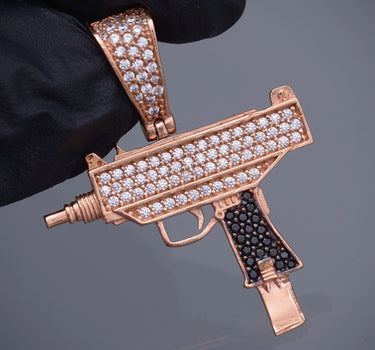 Dije mini uzi swarovski negro y blanco 3.85gr / Largo 3.4cm / Oro Rosado Nac M