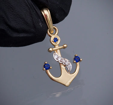 Dije ancla con swarovski azul y blanco 1.2gr / Largo 2.3cm / Oro Amarillo Nac M