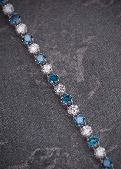 Pulso tenis con 126pts de diamantes azules y blancos 2.05gr / Largo 17.5cm / Oro Blanco (Joya) M