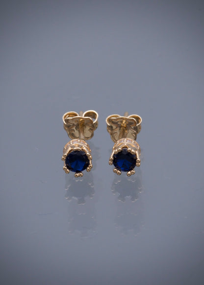 Topos corona con swarovski azul y blanco 1.6gr / Largo 0.4cm / Oro Amarillo Nac M