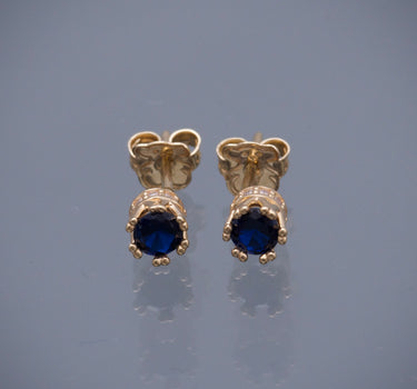 Topos corona con swarovski azul y blanco 1.6gr / Largo 0.4cm / Oro Amarillo Nac M