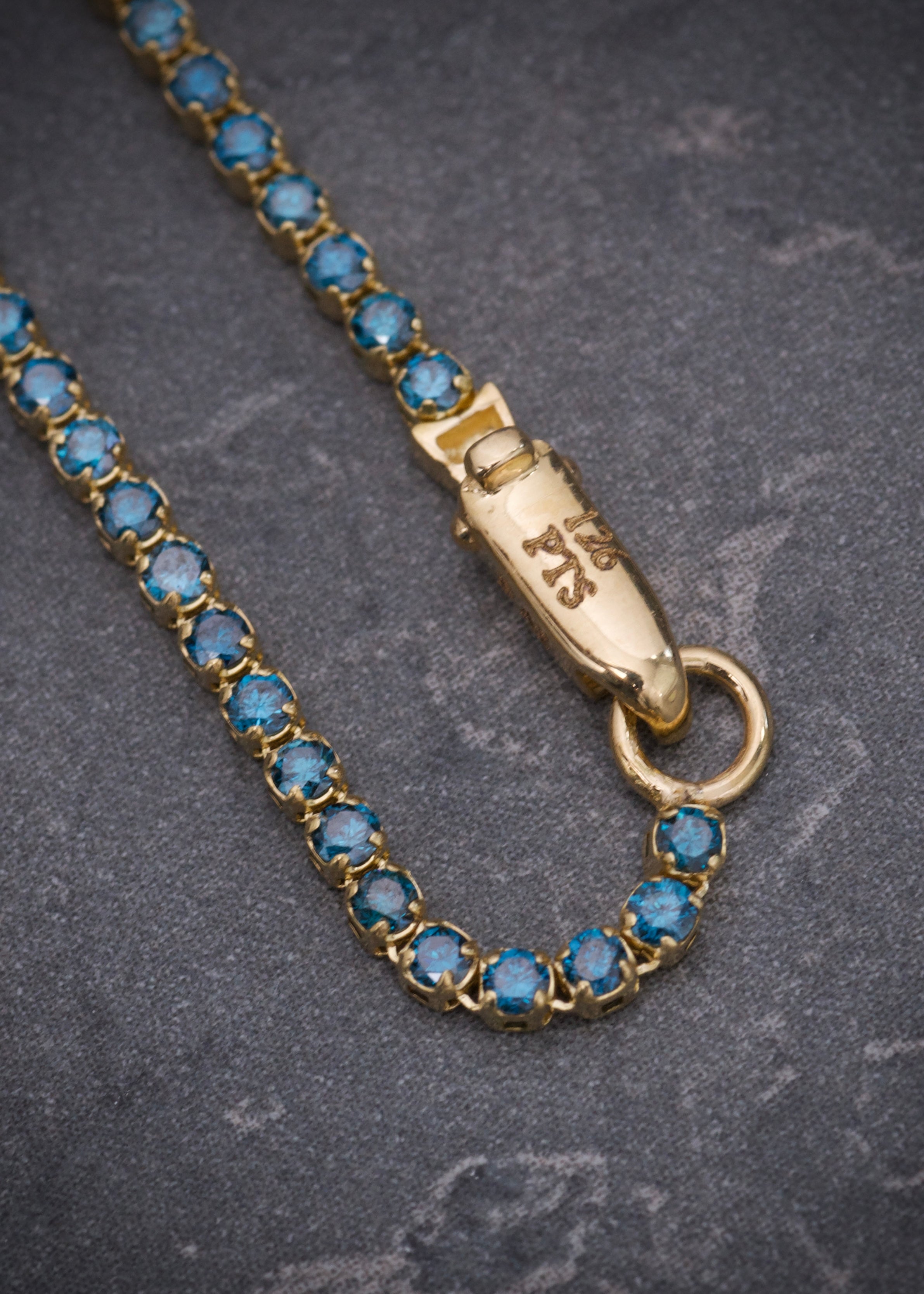 Pulso tenis con 126pts de diamantes azules 2.05gr / Largo 18cm / Oro Amarillo (Joya) B