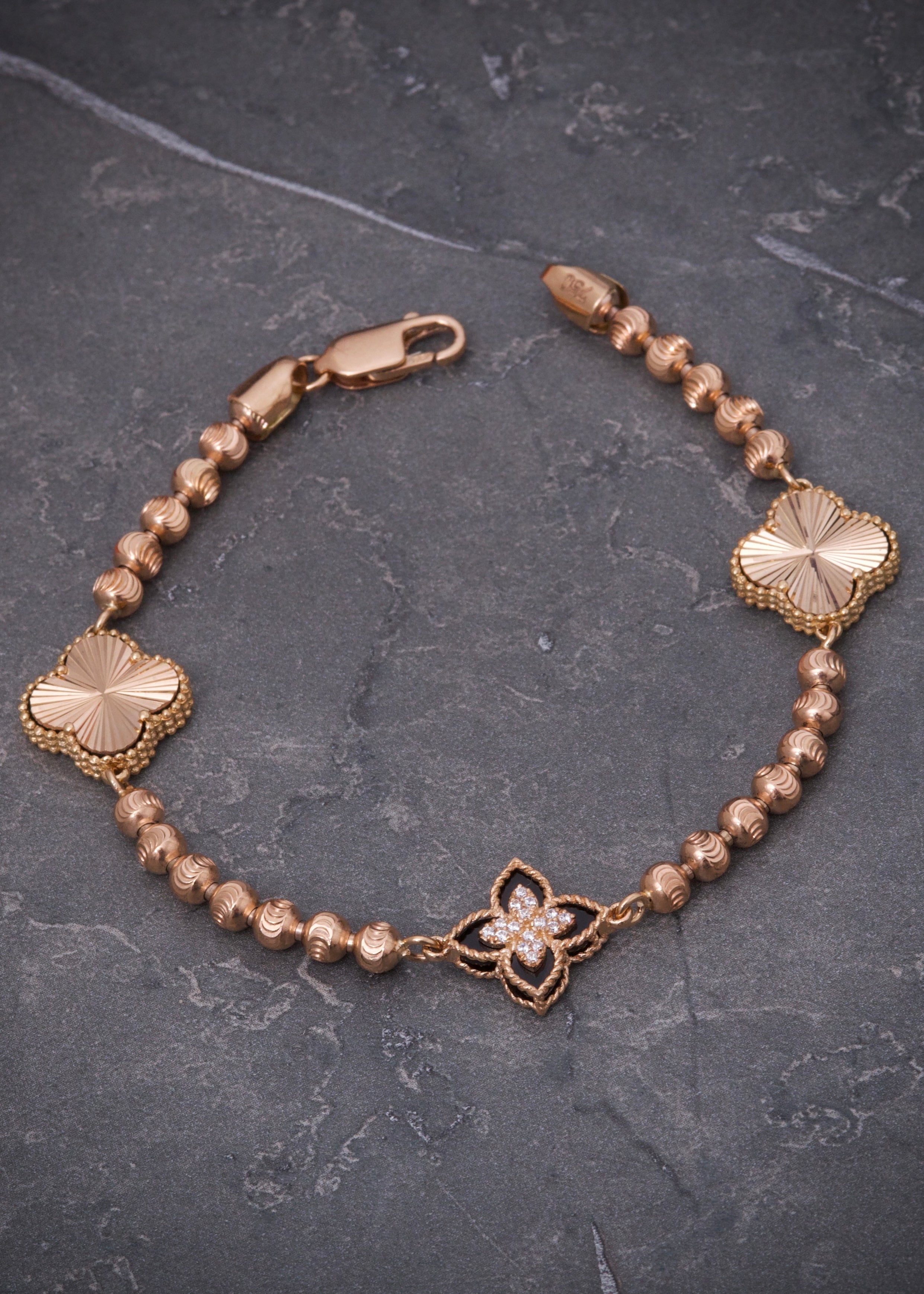 Pulso lucky clover piedra negra 12.4gr / Largo 19cm / Oro Rosado Nac B
