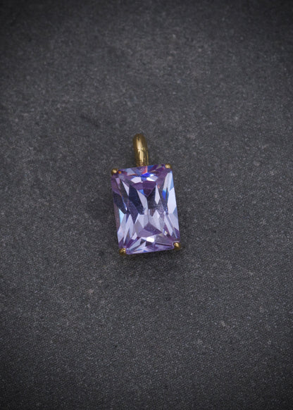 Dije con swarovski lila 0.6gr / Largo 1cm / Oro Amarillo Nac P