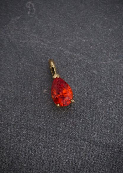 Dije con swarovski naranjado 0.45gr / Largo 0.9cm / Oro Amarillo Nac P