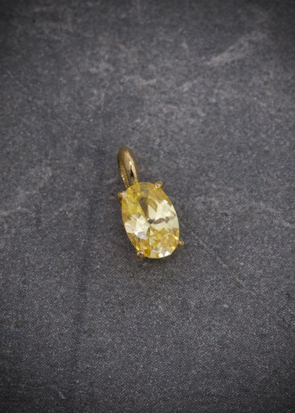 Dije con swarovski amarillo 0.4gr / Largo 0.9cm / Oro Amarillo Nac M