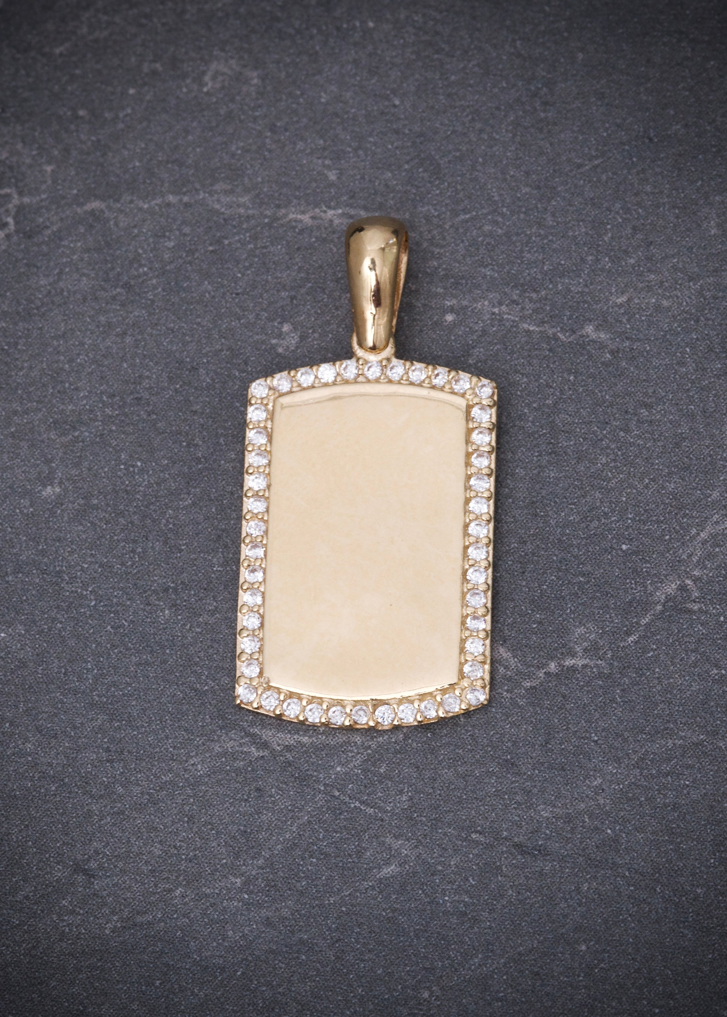 Dije placa con swarovski blanco 2.6gr / Largo 2.6cm / Oro Amarillo Nac P