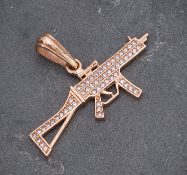 Dije de ametralladora con swarovski blanco 2.6gr / Largo 2cm / Oro Rosado Nac M