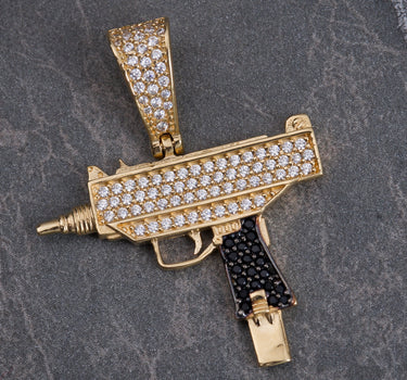 Dije mini-uzi con swarovski negro y blanco 3.7gr / Largo 3.3 cm / Oro Amarillo Nac B