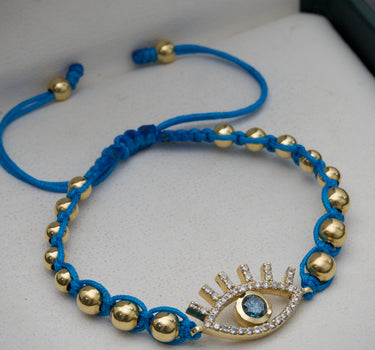 Pulsera en hilo azul con 38pts de diamante azul y 44pts de diamante blanco  4.35gr / Oro Amarillo (Joya) M