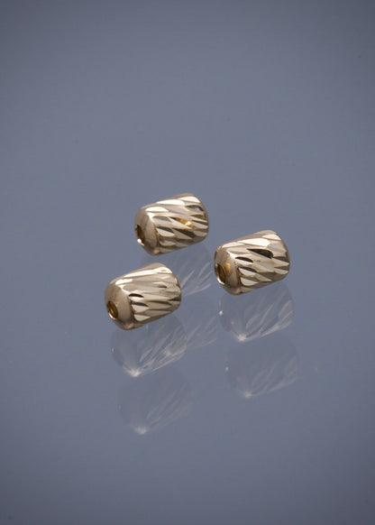 Herraje tubo diamantado 0.25gr / Largo 0.7cm / Oro Amarillo Nac B