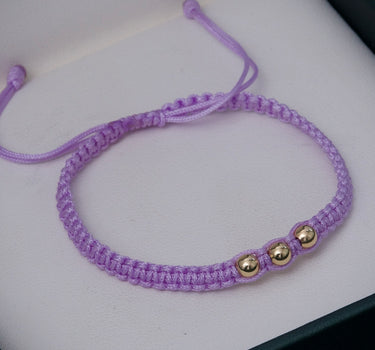 Pulsera en hilo morado con bolas lisas 4mm 0.25gr / Oro Amarillo (Joya) M