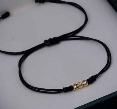 Pulsera en hilo negro con bolas diamantadas 3mm 0.15gr / Oro Amarillo (Joya) M