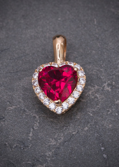 Dije corazon con swarovski fucsia y blanco 2.7gr / Largo: 1.8cm / Oro Rosado Nac M