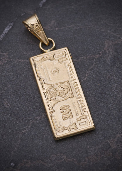 Dije dolar 1.4gr / Largo 2.9cm / Oro Amarillo Nac M