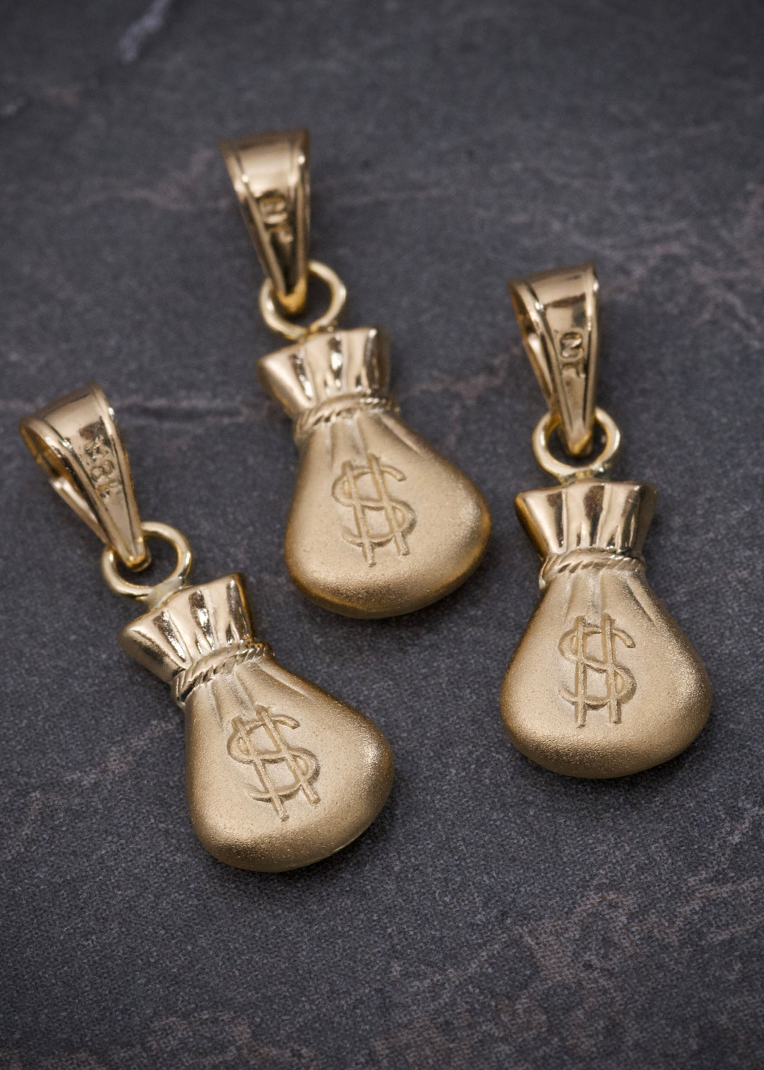 Dije bolsa de dinero 0.4gr / Largo 1.8cm — Oro Amarillo