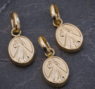 Dije jesus de la misericordia 0.35gr / Largo 1.4cm / Oro Amarillo Nac B