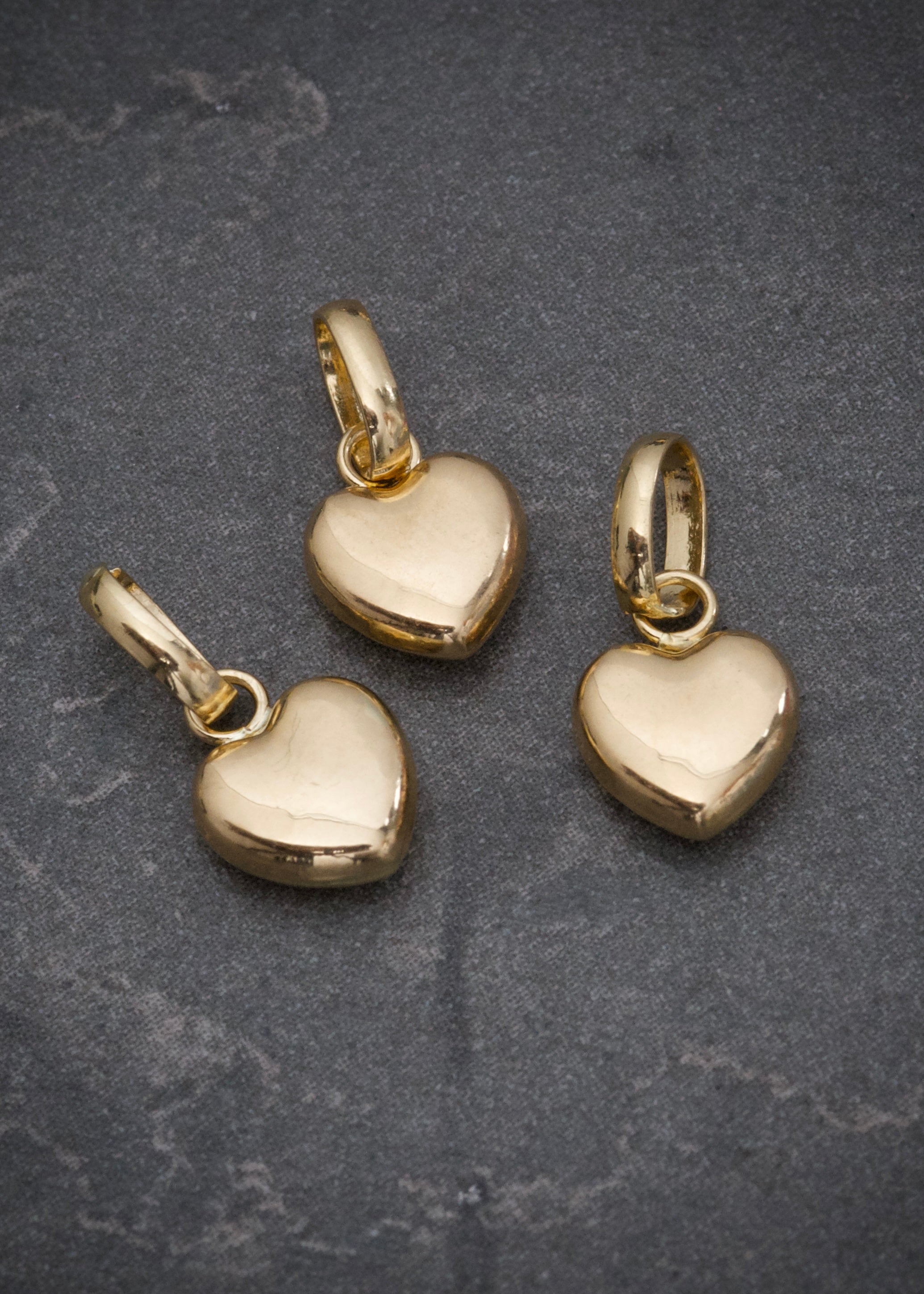 Dije  corazon liso 0.3gr /Largo 1.3cm / Oro Amarillo Nac B
