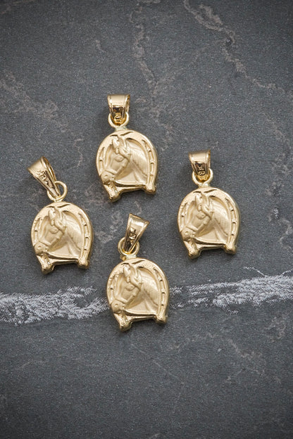 Dije de herradura de caballo 0.5gr / Largo 1.7cm / Oro Amarillo Nac M
