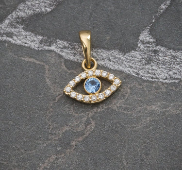 Dije ojo turco piedra central swarovski azul claro 0.6gr / 1.3cm / Oro Amarillo Nac B