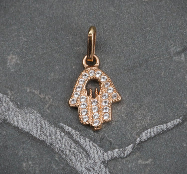 Dije mano hs con swarovski blanco 0.7gr / Largo 1.5cm / Oro Rosado Nac B