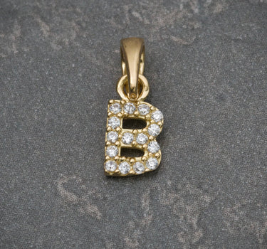 Dije de letra B con swarovski blanco 0.5gr / 1.4cm / Oro Amarillo Nac B