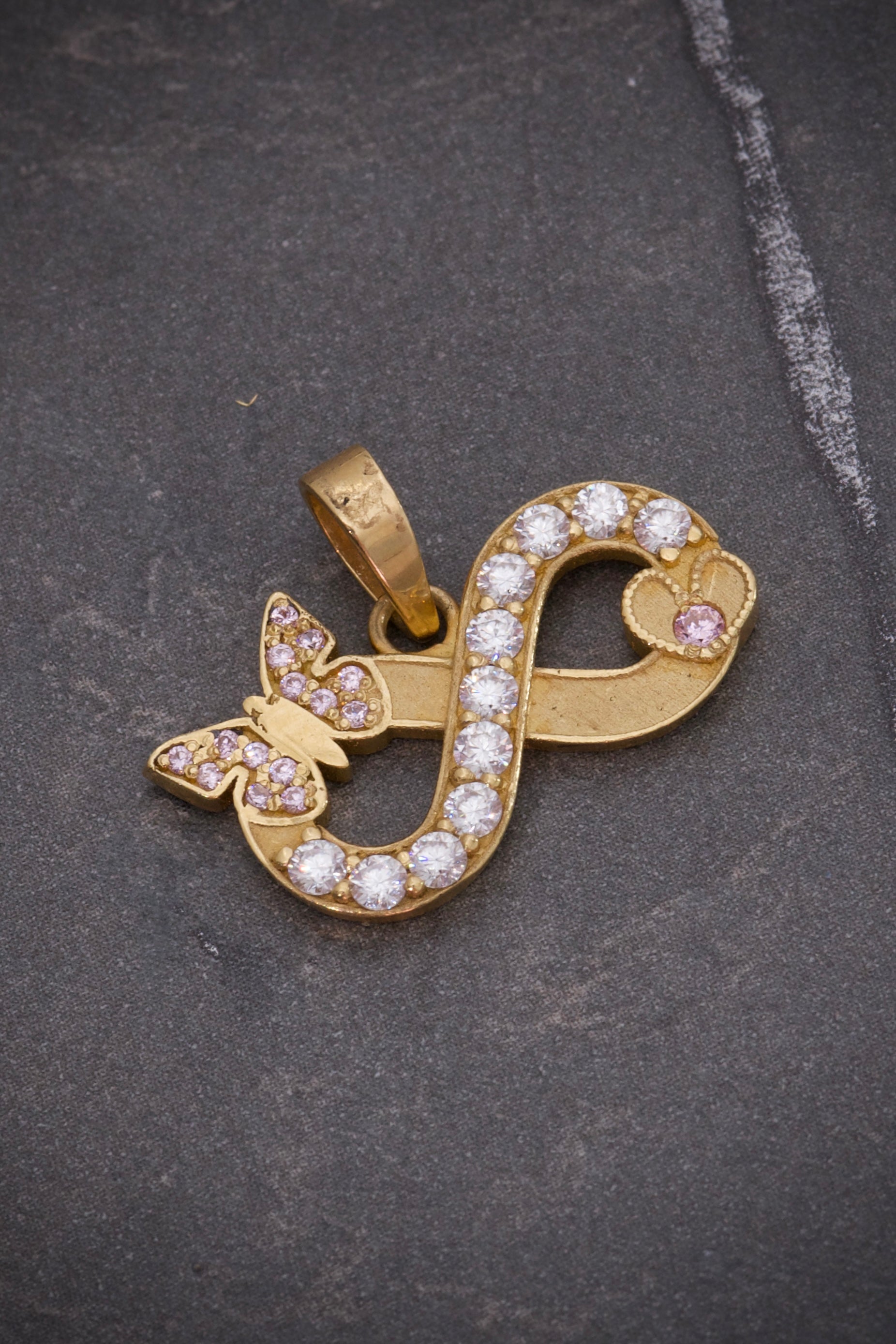 Dije de infinito con moissanitas 0.38qts (38pts) 3.1gr / Oro Amarillo (Joya) P