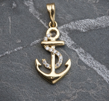 Dije De Ancla con Swarovski Blanco 2.35gr / Largo 2.7cm / Oro Amarillo Nac B