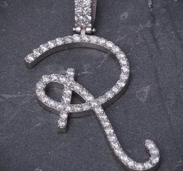 Dije letra R con 117pts de diamantes 5.4gr / Largo 4cm / Oro Blanco Nac (Joya) M