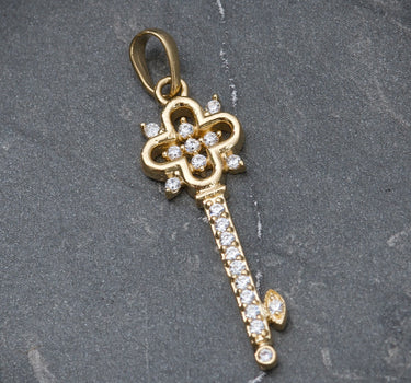 Dije de llave con swarovski blanco 1.7gr / 3.2cm / Oro Amarillo Nac B