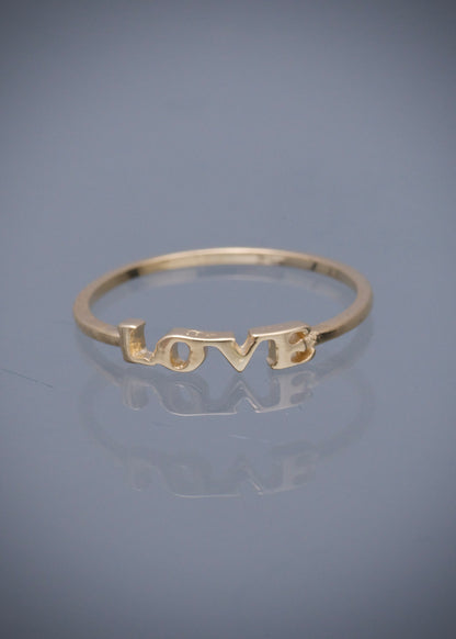 Anillo love 0.85gr / Talla: 5 1/4 / Oro Amarillo Nac B