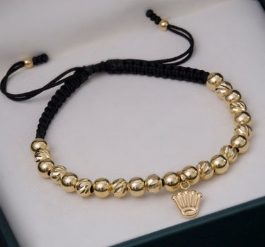 Pulsera en hilo negro con dije corona 3.5gr / Oro Amarillo (Joya) M