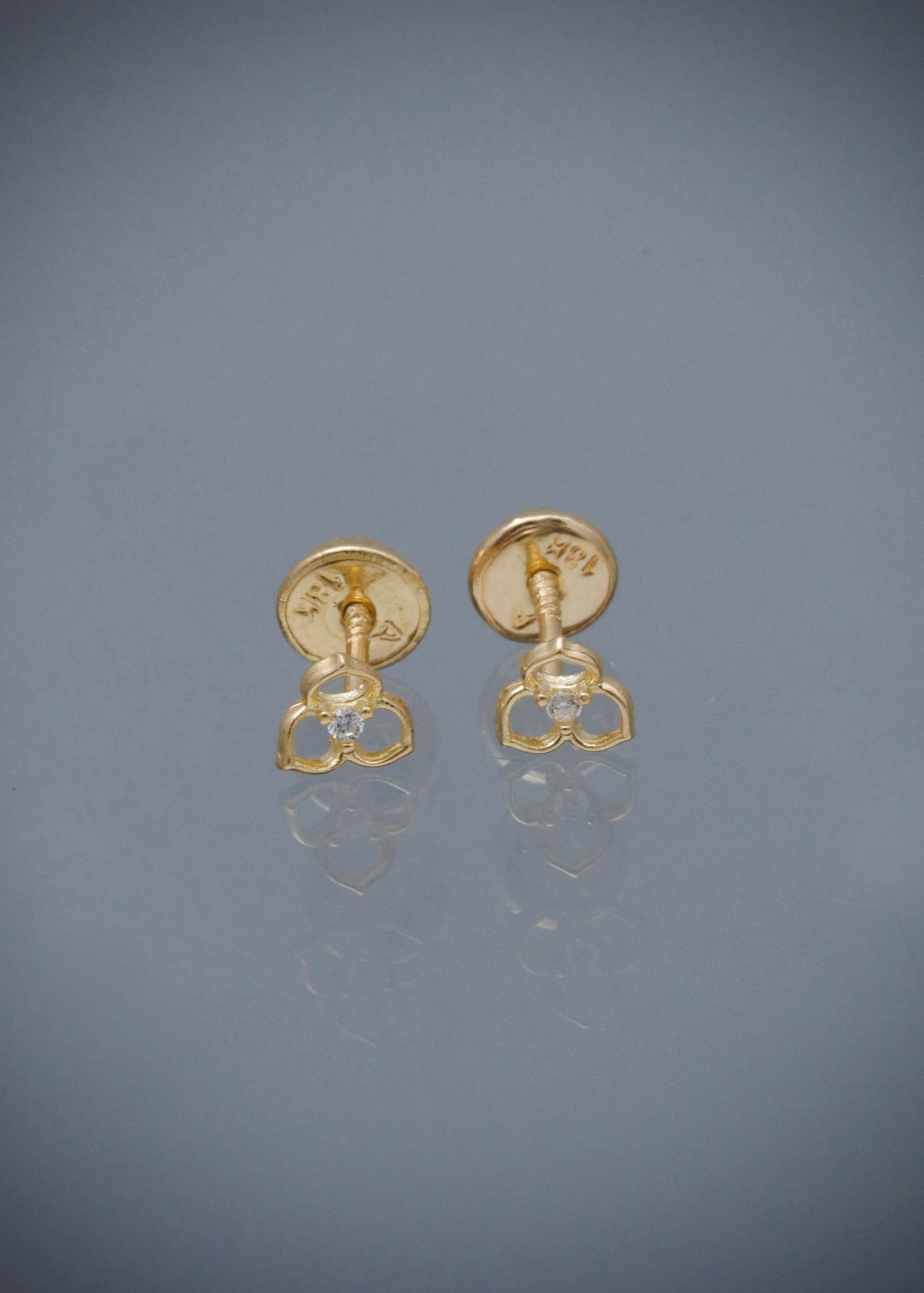 Topos flor con swarovski blanco 0.6gr / Largo 0.5cm / Oro Amarillo Nac B