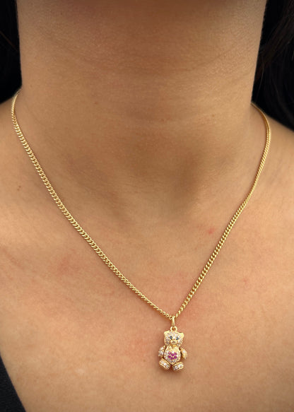 Dije oso articulado con swarovski blanco y fucsia 2.6gr / Largo 1.9cm / Oro Amarillo Nac B