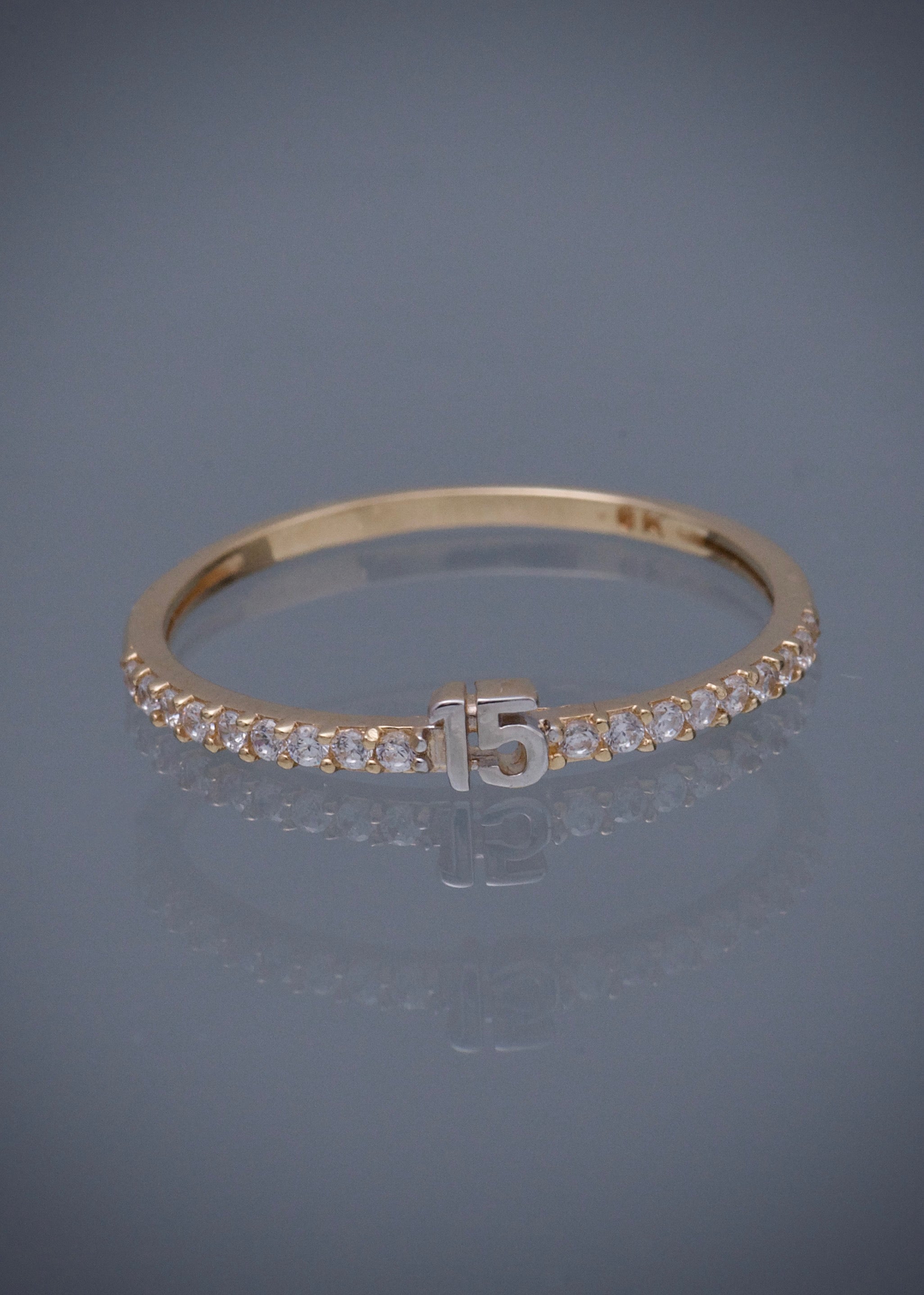 Anillo de 15s con swarovski blanco 1.35gr / TALLA 7 / Oro Amarillo Nac M