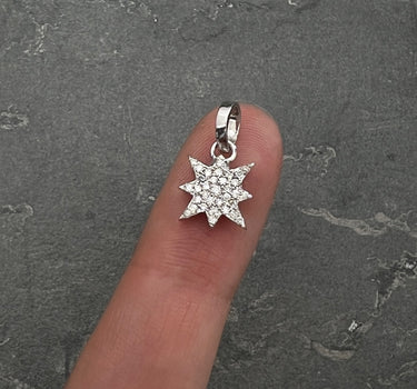 Dije estrella con 18pts de diamantes 1.6gr / Largo 1.5cm / Oro Blanco Nac (Joya) P
