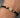 Pulsera en hilo negro con herraje flor 1.25gr / Oro Amarillo (Joya) M