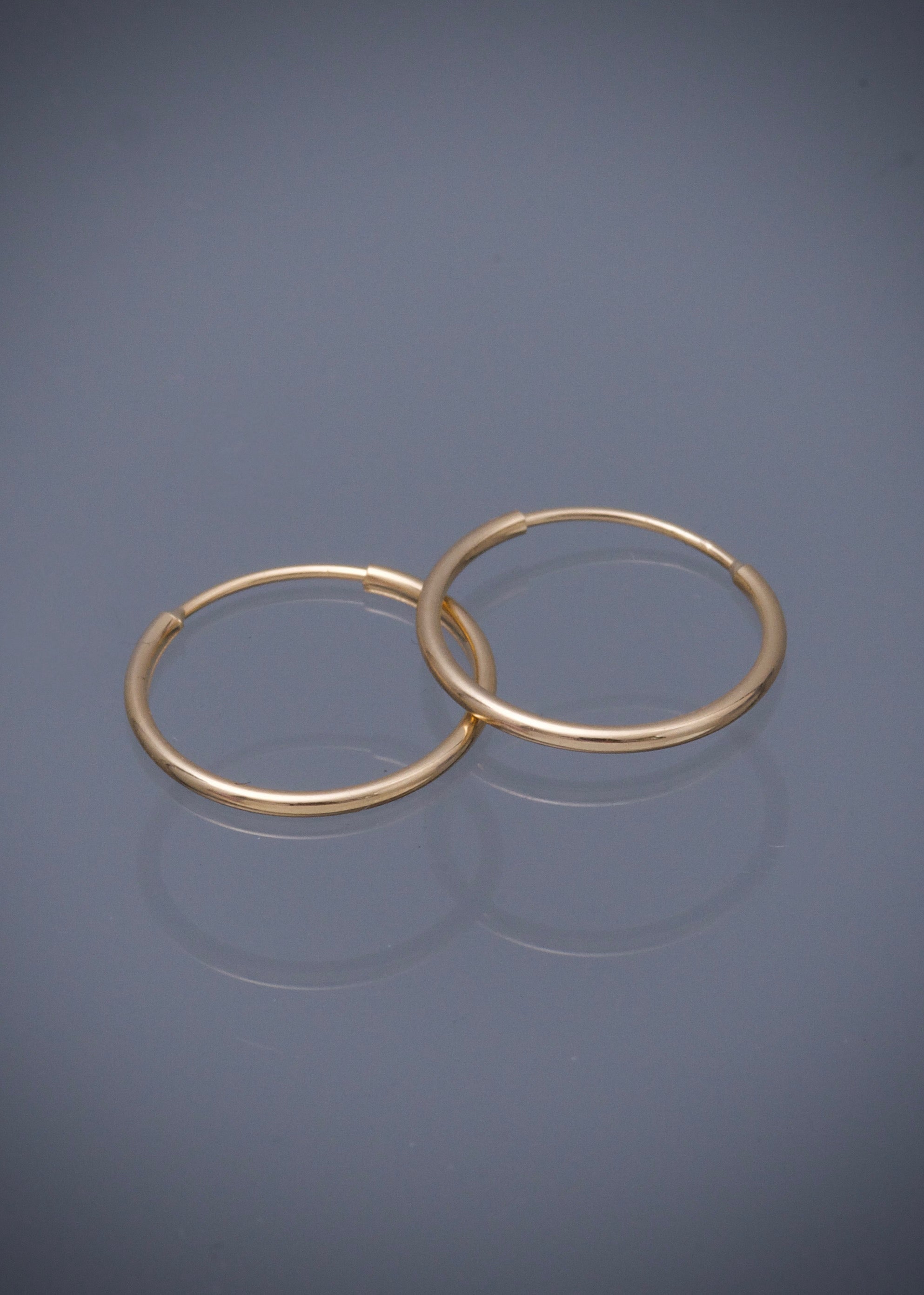 Candongas lisas 0.55gr / Largo 1.4cm / Oro Amarillo Nac M