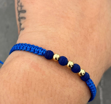 Pulsera en hilo azul con bolas lisas 4mm y neoprenos 0.25gr / Oro Amarillo (Joya) M