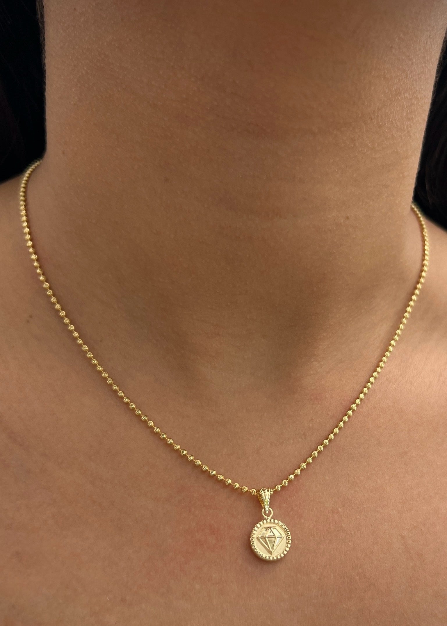 Dije diamante 0.6gr / Largo 1.7cm / Oro Amarillo Nac B