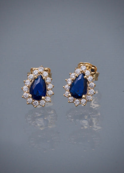 Topos gota con swarovski azul y blanco 1.7gr / Largo 1cm / Oro Amarillo Nac B