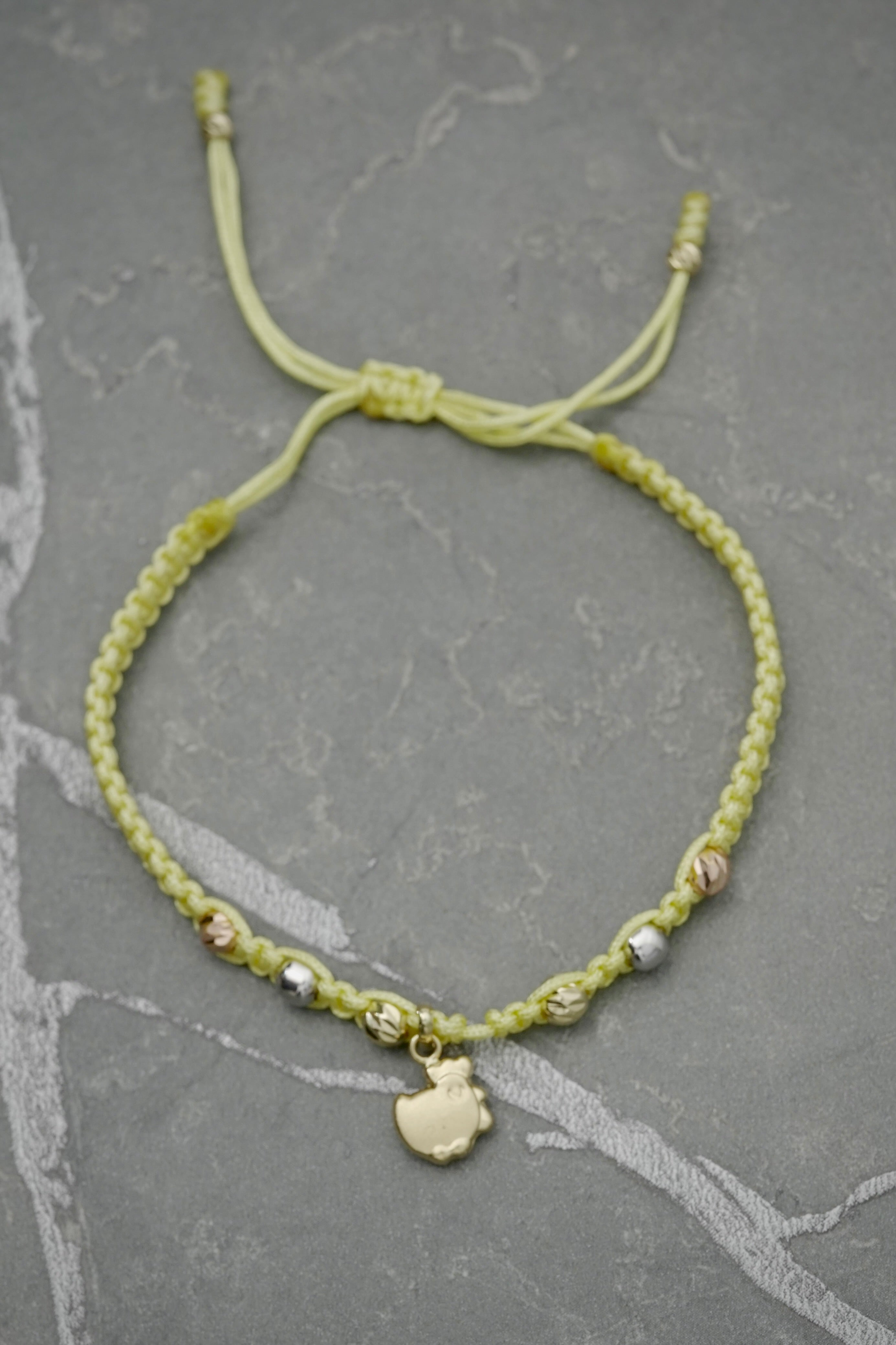Pulsera en hilo amarillo 1gr / Tres Oros (Joya) M