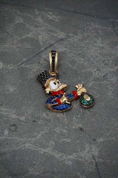 Dije tio rico con swarovski azul y negro 5.6gr / Largo 3.5cm / Oro Amarillo Nac P