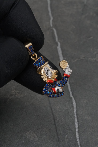 Dije tio rico con swarovski azul 3.45gr / Largo 3cm / Oro Amarillo Nac M